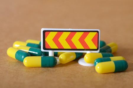 Cautionary Symbols: Capsules and Warning Arrows for Health Risks
