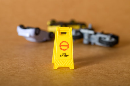 No Entry Sign with Overturned Miniature Vehicles â Accident Aftermath Sceneの写真素材