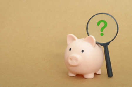 Piggy Bank with Magnifying Glass Question Mark â Financial Savings Inquiry Conceptの写真素材