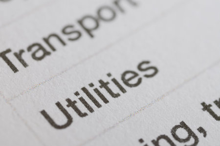 Close-Up of the Word "Utilities" on a Textured Paper â Part of an Organized Listの写真素材