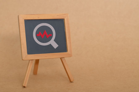 Cardiology Examination Symbol on Chalkboard with Wooden Easelの写真素材