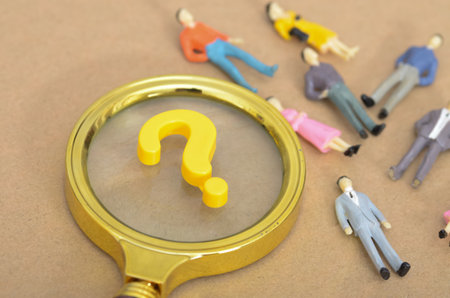 Exploring Human Identity: Symbolic Search with Question Mark and Figurinesの写真素材
