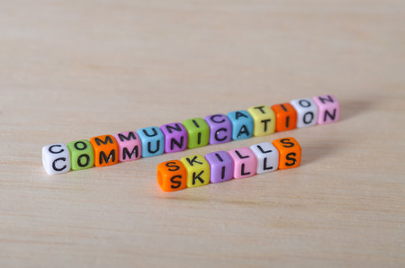 Communication Skills Concept with Beads on Wooden Surface â€“ Emphasizing Soft Skills in Modern...