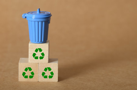 Sustainable Waste Disposal Concept with Mini Trash Can and Eco Iconsの写真素材