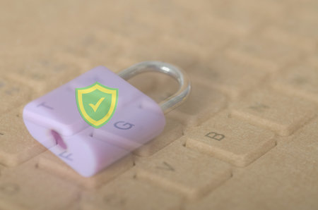 Strong Digital Security Concept with Purple Padlock and Green Shield on Keyboard