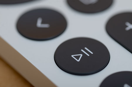 Close-Up of Play/Pause Button on Modern Device with Shallow Depth of Fieldの写真素材