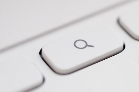 White Keyboard Key with Magnifying Glass Icon for Search Function
