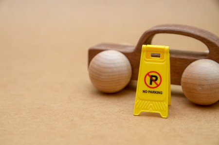 Wooden Car Parked Behind No Parking Sign Illustrating Traffic Rule Enforcement and Parking...