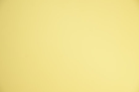 Blank Yellow Surface with Ample Copy Space: A Versatile and Unobtrusive Backdrop for Graphic Elements.の写真素材