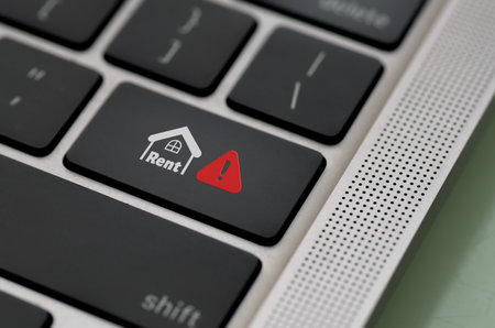 A black keyboard features a custom key with a house icon, Rent label, and a red warning symbol,...