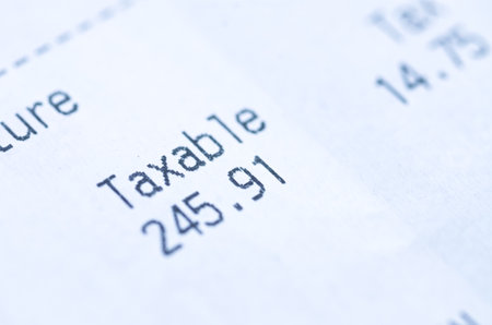 a receipt highlights the word "Taxable," symbolizing the financial obligations, expenses, and budgeting inherent in every transaction.の写真素材