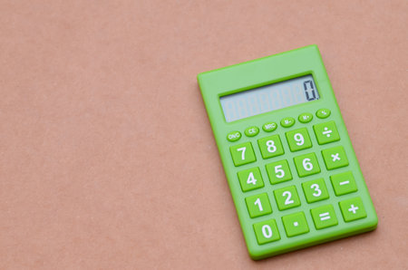 This simple device symbolizes taking control of money, meticulously tallying expenses for a clear financial outlook.の写真素材