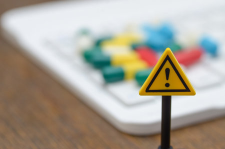 A potent visual metaphor cautioning against the dangers of buying counterfeit drugs and seeking medical advice online.の写真素材