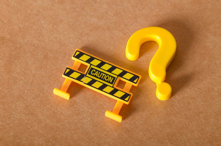 A yellow question mark next to a CAUTION barrier highlights the importance of asking questions...
