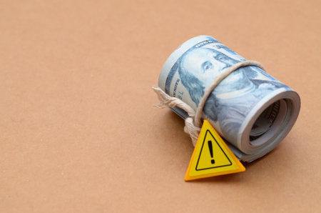 Economic Hazard Alert: A clear visual metaphor for financial risk, with a warning sign on a roll of...