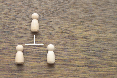 Hierarchy and Connection: A single figure at the top connects to two below, visually symbolizing a...