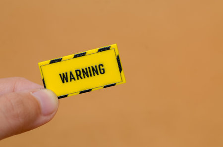 Bold "WARNING" Hazard Sign for Risk Assessment and Safety Protocolsの写真素材
