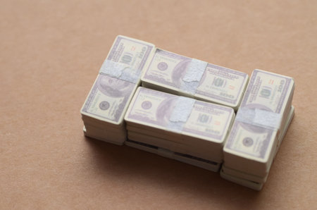 Miniature Bundles of Cash: Financial Security and Savings Conceptの写真素材