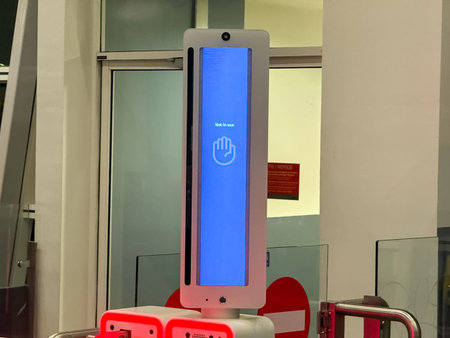 Automated Biometric Kiosk: Not in Use Signal on Vertical Screen at Airport Gate