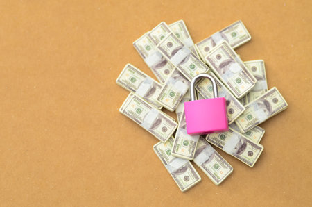 Secure Savings: Currency Stacks with Padlock Symbolizing Safety