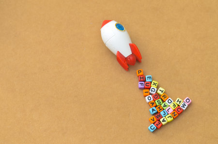 Education and Learning: Toy Rocket Taking Off from Alphabet Blocksの写真素材