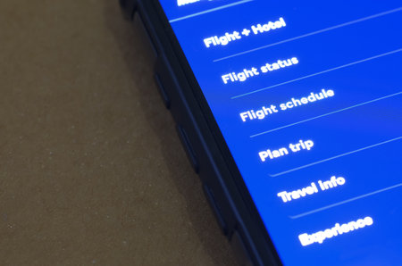 Smartphone Display with Travel Navigation Menu for Flight and Hotel Booking