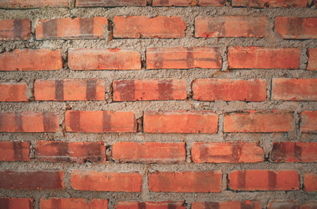 Classic Architectural Pattern of Weathered Brickwork in Earthy Orange Shades