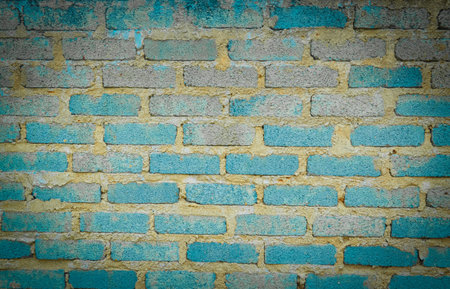 Weathered Brick Wall with Peeling Turquoise and Blue Paint Texture