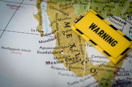 Map of Mexico with Bold Yellow Warning Sign Highlighting Security Risks
