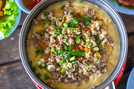 Steamed Egg with Minced Pork on wood table close up asia food.