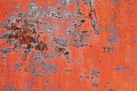 Rusty metal surface with old peeled paint for use as a texture or background