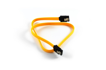 Yellow SATA cable isolated on white backgroundの写真素材