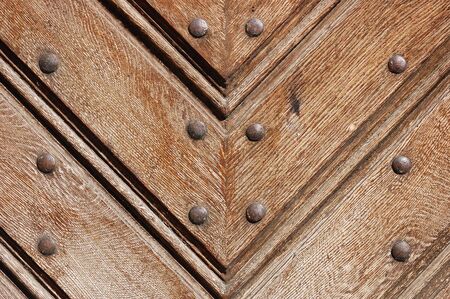 Fragment of durable wooden gate in old castle