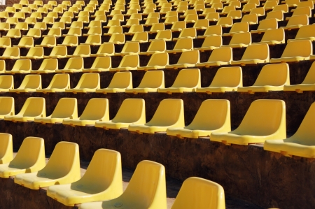 Rows of empty yellow seats in a open-air theatre  amphitheatre の写真素材