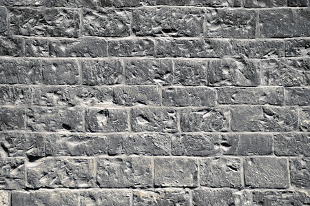 Fragment of a wall made of rough bricksの写真素材
