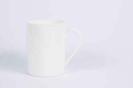 Close up of a simple white mug for templates, pictures and quotesの写真素材