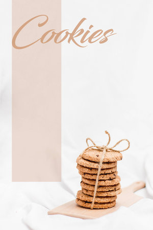 Photo of a sweet homemade cookies wrapped with rope on a wooden board and white background with styled quote Cookiesの写真素材