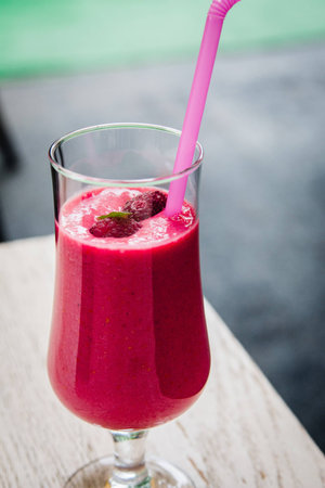 Close up of healthy squeezed juice made of raspberriesの写真素材