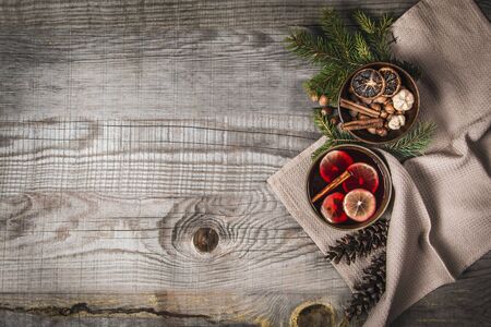 Fruit tea with cinnamon and lemon and decoration on a wooden backgroundの写真素材