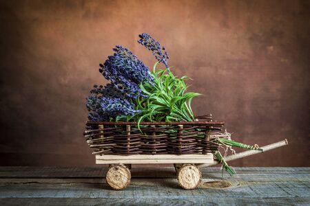 Vintage photo of a beautiful lavender flowers on a wooden tableの写真素材