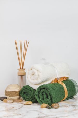 Spa objects and elements on a marble table and white backgroundの写真素材