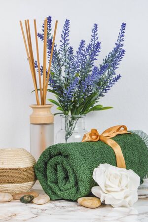 Spa objects and elements on a marble table and white backgroundの写真素材