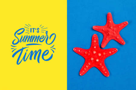 Red starfishes on a blue and yellow background with the text Summer Timeの写真素材