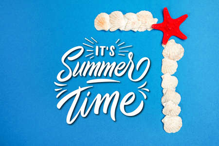 Starfish and seashells on a blue background and text Summer Timeの写真素材
