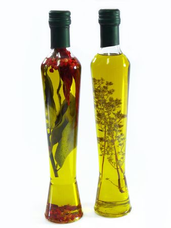 Extra virgin olive oil with herbs in bottlesの写真素材