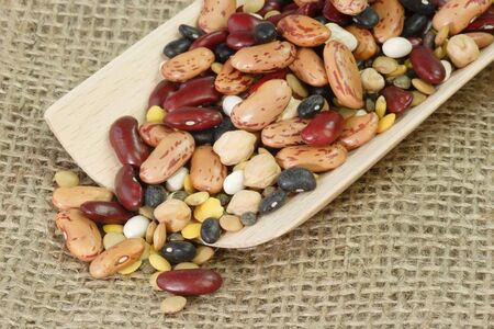 Detail from mixed dried Beans on a wooden shovel