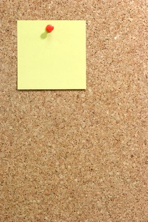  Colorful blank post it note affixed to the corkboard.の写真素材