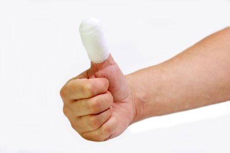 Bandaged finger close up on bright backgroundの写真素材