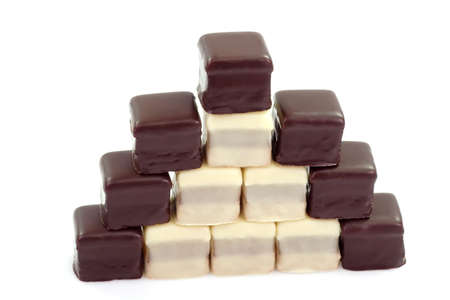 Pyramid of sweet chcolate confectionary on bright backgroundの写真素材