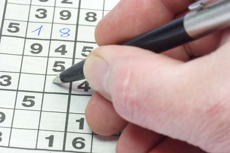 Playing sudoku puzzle in detail. の写真素材